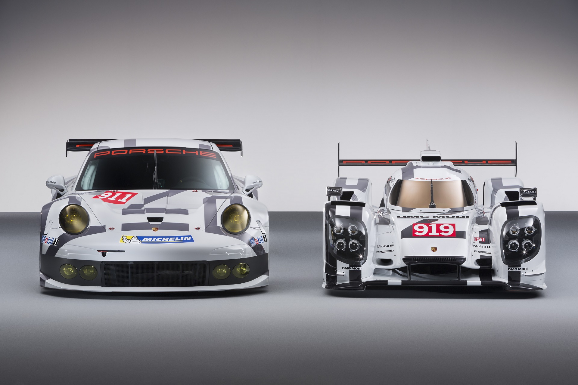 2014 Porsche Motorsport Worldwide- 919 Hybrid-911 RSR- Head-On.jpg