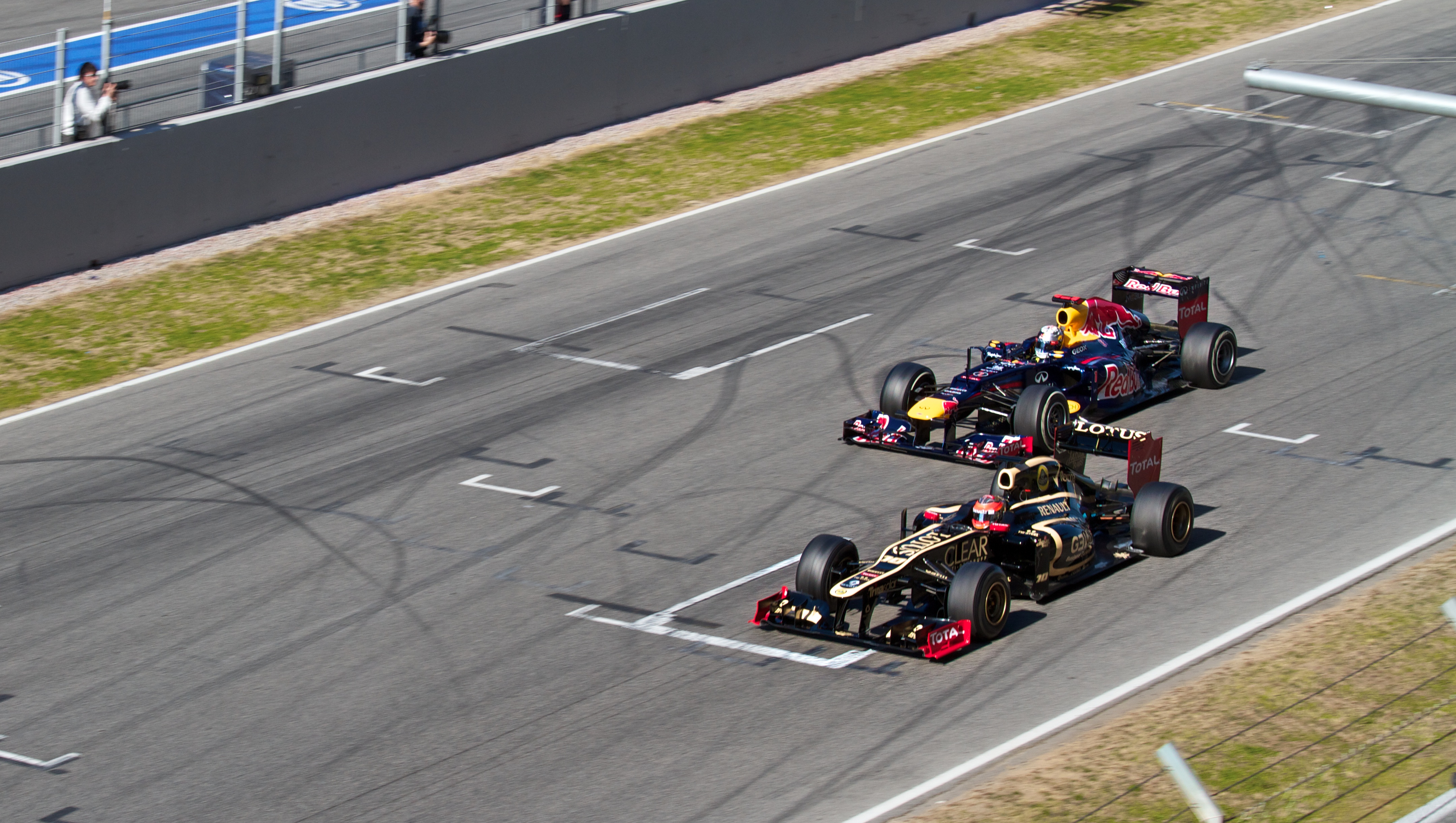 Grosjean_Lotus_and_Vettel_Red_Bull.jpg